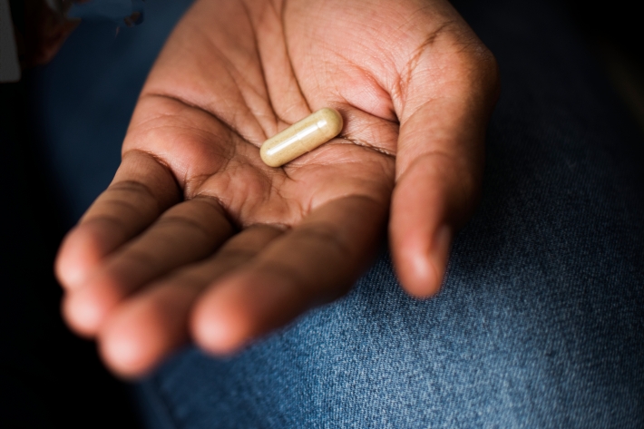 Akkermansia Woman taking pills for her health